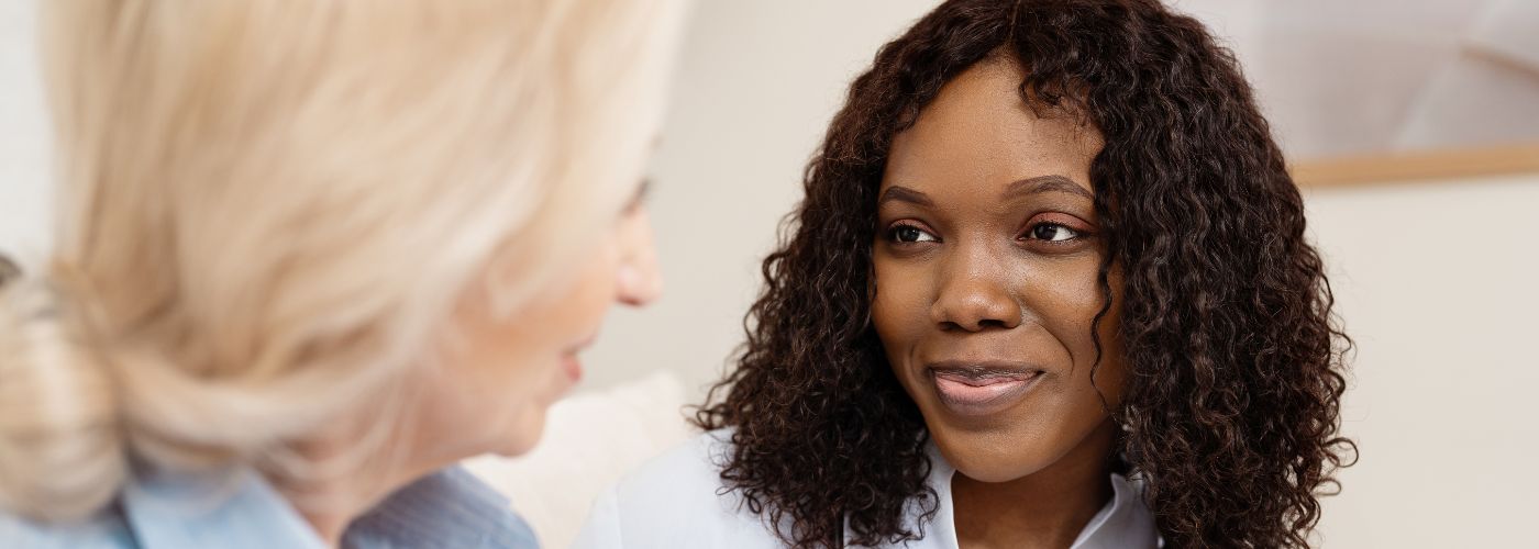 Doctor speaking with patient, focused look